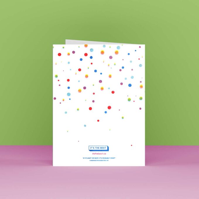 Back view of a happy birthday card with multi-colored falling dots that look like confetti